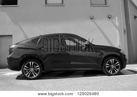Saverne, Bas-Rhin, France -May 7, 2016: Black BMW X6 parked on the side of the street in the city of Saverne.