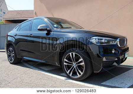 Saverne, Bas-Rhin, France - May 7, 2016: Black BMW X6 parked on the side of the street in the city of Saverne.