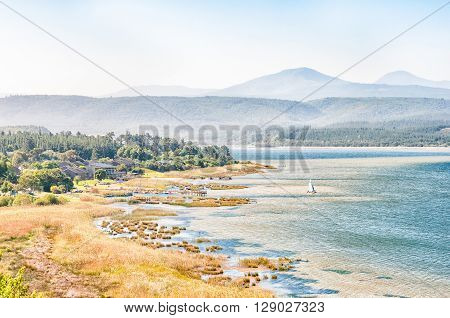SEDGEFIELD SOUTH AFRICA - MARCH 4 2016: A gloomy day at a holiday resort at Swartvlei (Black Lake) the largest of the lakes in the Wilderness Lake Area