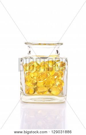 Fish Oil Capsules In Translucent Bottle On White Background