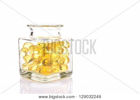 Fish Oil Capsules In Translucent Bottle On White Background