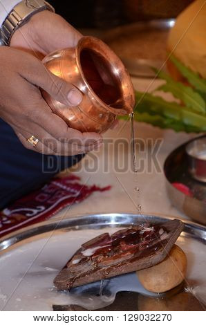 Men  Doing Pray Of Lord Ganesha For Wedding
