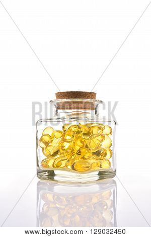 Fish Oil Capsules In Translucent Bottle On White Background