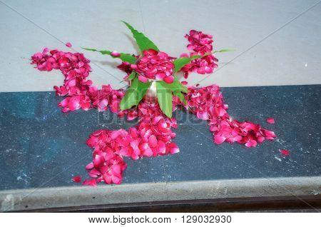 Swastik Created With Pink Rose  For Welcoming New Bride And Groom