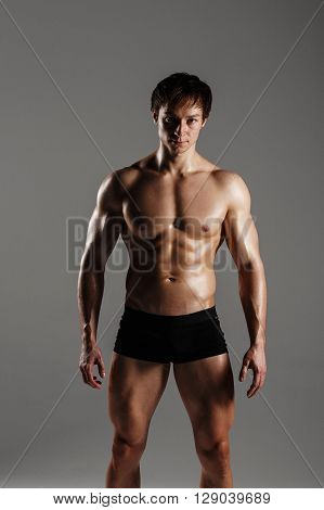 Strong Athletic Man Showing Muscular Body And Sixpack Abs. Showing His Body. Fitness Model. Great Fo
