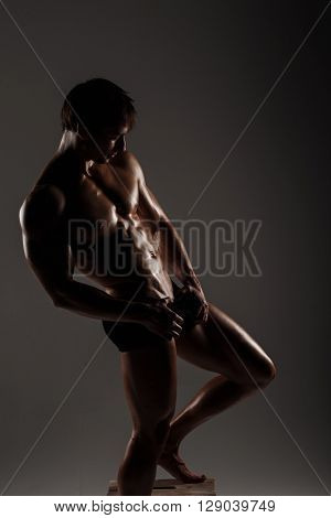 Muscular Male Model Bodybuilder Before Training. Studio Shot On Gray Background. Fitness Model. Grea