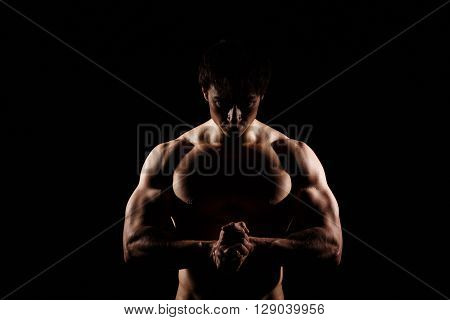 Muscular And Fit Young Bodybuilder Fitness Male Model Posing Over Black Background. Perfect Fitness
