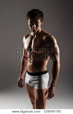 Strong Athletic Man Showing Muscular Body And Sixpack Abs. Showing His Body. Fitness Model. Great Fo