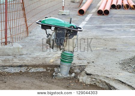 Gasoline Or Diesel Vibratory Plate Compactor At Road Construction Site
