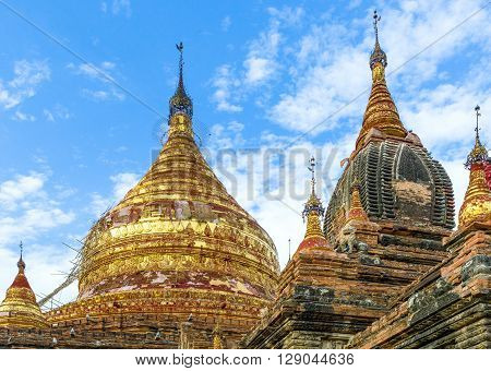 Myanmar, Bagan, the golden pagoda in the plain with thousand of 880-year old temple ruins.