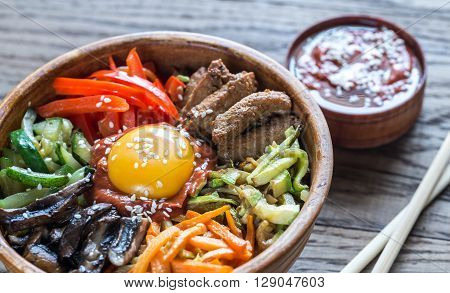 Bowl Of Bibimbap On The Wooden Table