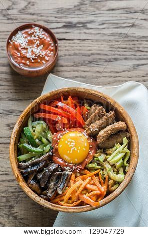Bowl Of Bibimbap On The Wooden Table