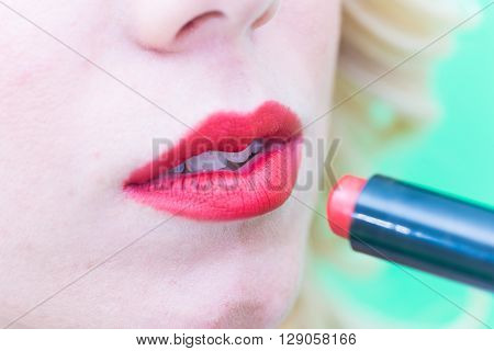 Lips with lipstick makeup for the face.
