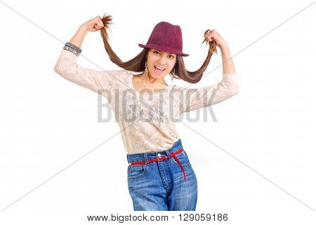 Young smiling woman. Long hairs in hands. Soft sunny colors. Beautiful smiling girl. Red hat. Woman summertime. Isolated portrait. Fasion concept.