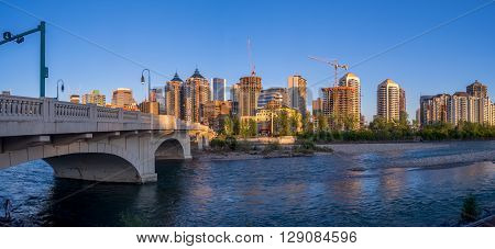 CALGARY, CANADA - MAY 7: Panorama of Calgary's skyline along the Louise Bridge on May 7, 2016 in Calgary, Alberta. The Louise Bridge connects Kensington with downtown Calgary over the Bow River.