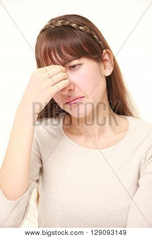 portrait of young woman suffers from Asthenopia