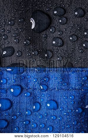 black and blue Waterproof textile background with water drops