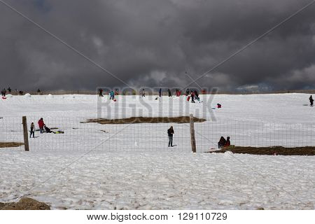 SERRA DA ESTRELA, PORTUGAL - APRIL 24, 2016: People on the mountain ski resort in Serra da Estrela. Serra da Estrela is the only ski resort in Portugal, in April 2016. Serra da Estrela, Portugal