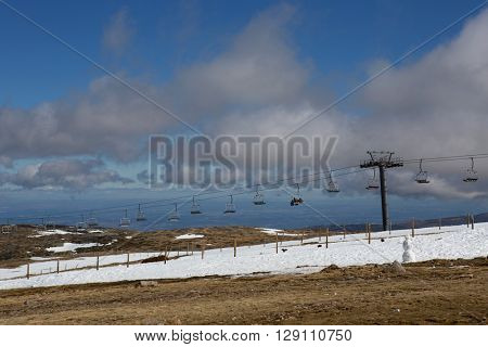 SERRA DA ESTRELA, PORTUGAL - APRIL 24, 2016: People on the mountain ski resort in Serra da Estrela. Serra da Estrela is the only ski resort in Portugal, in April 2016. Serra da Estrela, Portugal