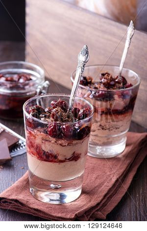 Homemade chocolate mousse dessert with tasty cherries
