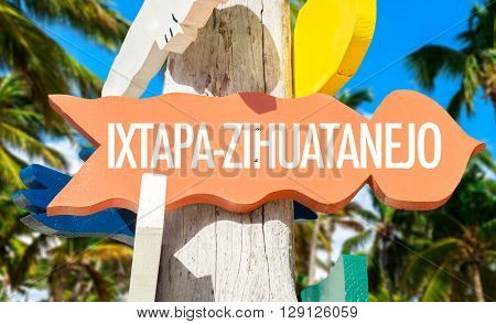 Ixtapa-Zihuatanejo signpost with palm trees