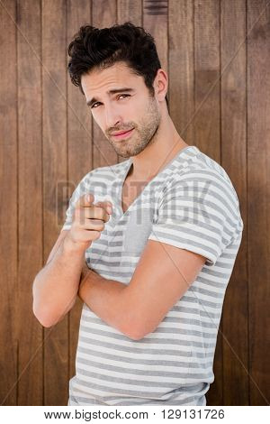 Portrait of handsome man pointing at fis finger