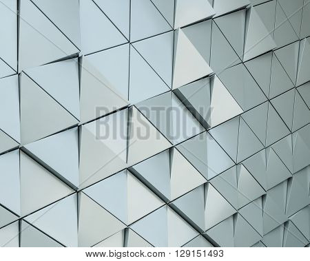 Abstract close-up view of modern aluminum ventilated facade of triangles