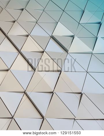 Abstract close-up view of modern aluminum ventilated facade of triangles