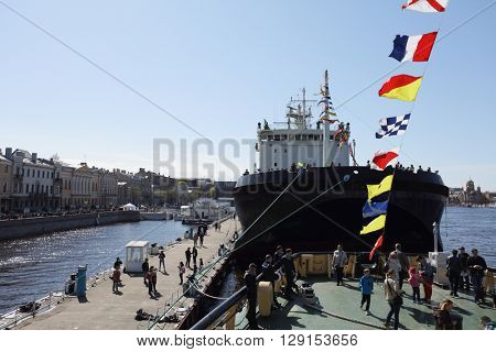 ST. PETERSBURG, RUSSIA - MAY 2, 2016: People at the icebreaker Mudyug during 3rd Icebreaker Festival. It's unique fest dedicated to icebreaker fleet