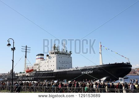ST. PETERSBURG, RUSSIA - MAY 2, 2016: People waiting in line on English embankment for visit the icebreaker Mudyug during 3rd Icebreaker Festival. It's unique fest dedicated to icebreaker fleet
