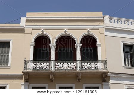 Balconies in old houses of small Greek cities. Heraclion