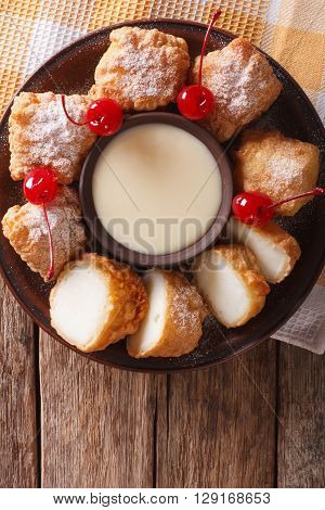 Dessert Leche Frita With Condensed Milk And Cherries Closeup. Vertical Top View