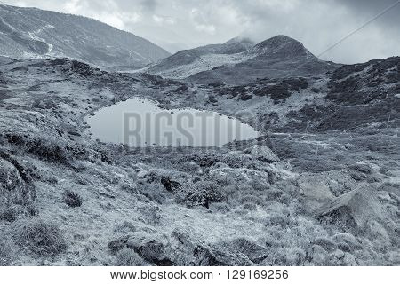 Winter view in black and white of Kalapokhri lake Sikkim Himalayan mountain range Sikkim - It is one of beautiful remote placed lakes of Sikkim.