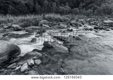 Beautiful Reshi River water flowing through stones and rocks at dawn Sikkim India. Reshi is one of the most famous rivers of Sikkim flowing through the state and serving water to many local people.