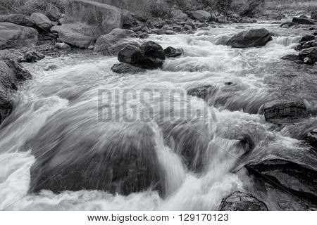 Beautiful Reshi River water flowing through stones and rocks at dawn Sikkim India. Reshi is one of the most famous rivers of Sikkim flowing through the state and serving water to many local people.