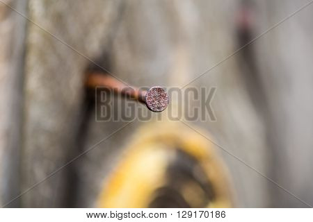 old wooden Board with a rusty nail, macro shooting
