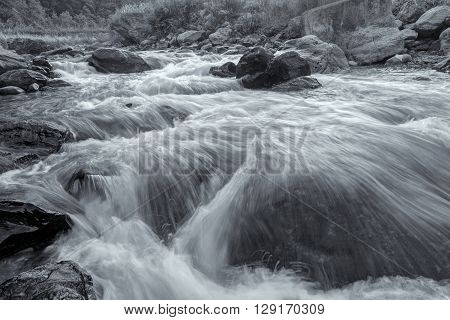 Beautiful Reshi River water flowing through stones and rocks at dawn Sikkim India. Reshi is one of the most famous rivers of Sikkim flowing through the state and serving water to many local people.