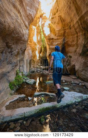Hiker running along the canyon towards the sunlight. Back view. Avakas Gorge Cyprus in sunny day.
** Note: Soft Focus at 100%, best at smaller sizes