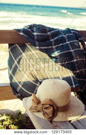 Accessories for relaxing on the beach on the veranda overlooking the sea. Windy sunny day in Cyprus Akamas Peninsula.