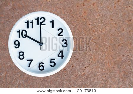 Clock On Steel Rusty Background