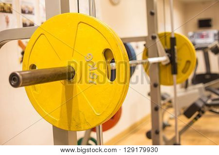 smith machine barbell in fitness room for weight training and muscle building
