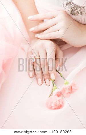 Pink Carnation flower in the hands of a girl