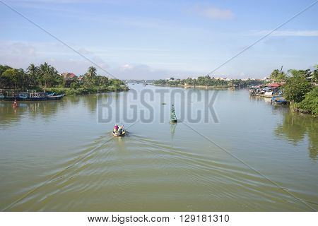 HOI AN, VIETNAM - JANUARY 04, 2016: The Thu Bon river in the early morning Hoi An. Tourists in the morning floating on the river Thu Bon. Tourist  landmark of theVietnam