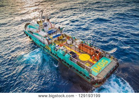 crew boat receive and transfer passenger to oil and gas processing platform and loading cargo
