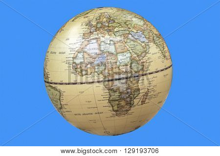 Continent of africa depicted on world globe isolated on blue background