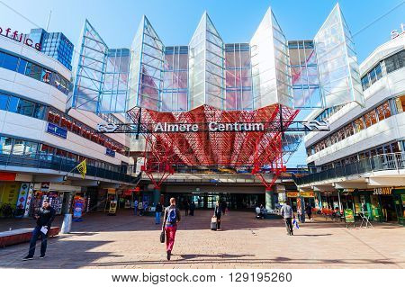 Almere Netherlands - April 19 2016: railway station of Almere with unidentified people. Almere is a fast growing planned city. With a population of about 200000 it is the 7th largest Dutch city