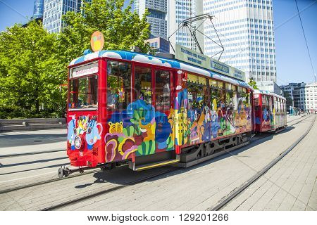 FRANKFURT GERMANY - MAY 8 2016: people enjoy the ride with the Ebbelwei express in Frankfurt Germany The Ebbelwei-Express is a touristic line established in 1977.