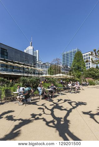 People Relax At The Bank Of River Main In Nizza Gardens