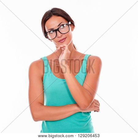 Contemplating Brunette Woman With Green Tank Top