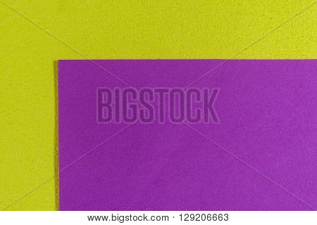 Eva foam ethylene vinyl acetate smooth pink surface on lemon yellow sponge plush background